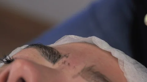 Microblading,Woman having eyebrows drawn and tinted with pencil. Stock Footage 114311161