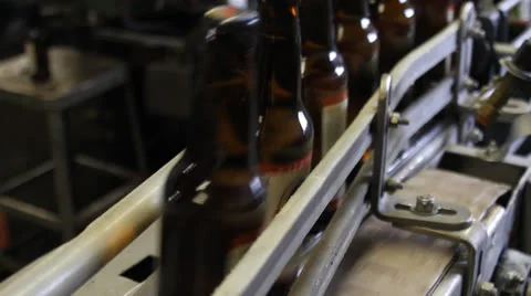 Microbrewry Bottles on Conveyor Stock Footage 25542086
