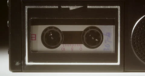 Microcassette Recorder Reels Turning With Soft Glowing Light Stock Footage 140077433