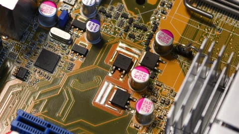 Microchip and Capacitors on modern PC Motherboard. Stock Footage 247453458