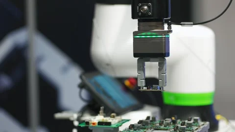 Microchip and microprocessor assembly with automated robotic arm factory Stock Footage 277888098