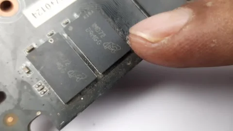 Microchip attached to the graphics card PCB Stock Footage 276319996