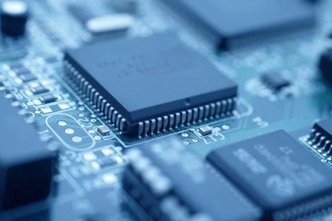 Microchip on Circuit Board in Blue Technology Macro Close-Up Stock Photos