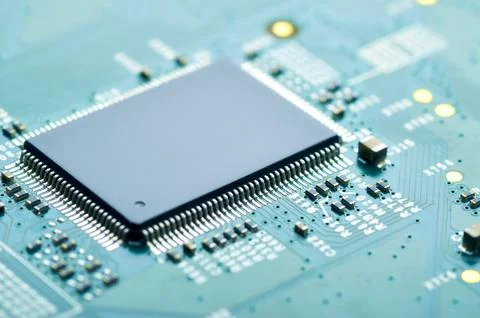 Microchip on an electronic board close-up Stock Photos