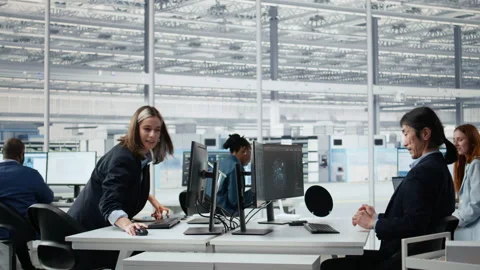 Microchip facility senior manager using AI to examine semiconductor substrates Stock Footage 335880154