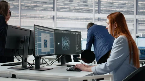 Microchip factory lab expert analyzing chip architecture with neural network AI Stock Footage 335881587