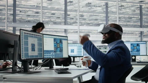 Microchip factory lab specialist using VR headset to analyze chip architecture Stock Footage 335880455