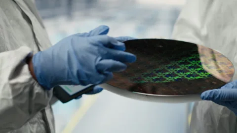 Microchip factory SOC architecture designers analyze semiconductor substrates Stock Footage 333378574