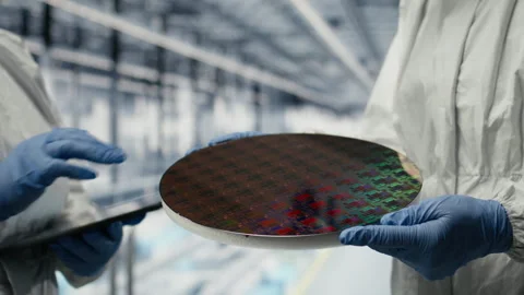 Microchip factory SOC architecture designers analyze semiconductor substrates Stock Footage 333382569