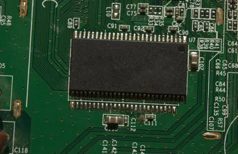Microchip on green electronic pcb closeup Stock Photos