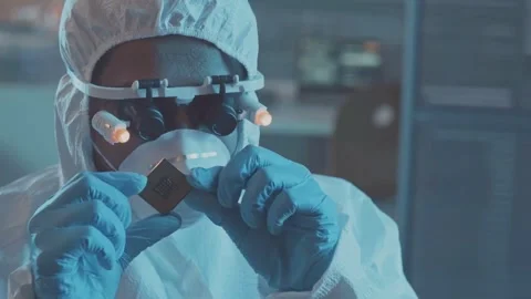 Microchip Inspection in High-Tech Lab: Close-Up Precision Work Stock Footage 320503827