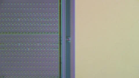 Microchip integrated circuit architecture under microscope Video stock 322896347