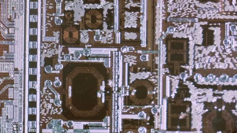 Microchip integrated circuit architecture under microscope Video stock 322896357