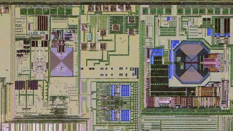 Microchip integrated circuit architecture under microscope Stock Footage 322896364