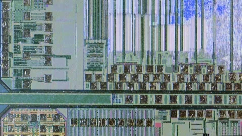 Microchip integrated circuit architecture under microscope Stock Footage 322896476