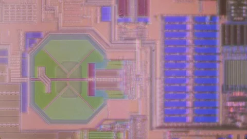 Microchip integrated circuit architecture under microscope Stock Footage 323070922