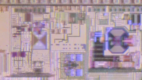Microchip integrated circuit architecture under microscope Stock Footage 323070948