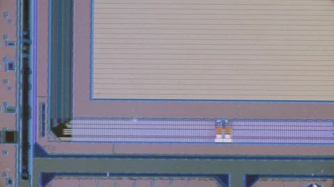 Microchip integrated circuit architecture under microscope Stock Footage 323071220