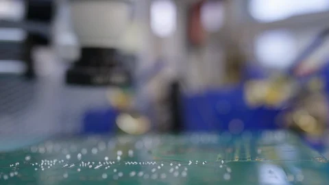 Microchip manufacturing close up in lab with microscope Video stock 89513946