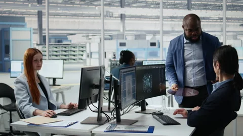 Microchip RD factory professionals reviewing production using AI assistant Stock Footage 335879776