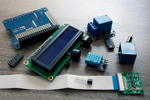 Microchip on a stacked breadboard for electrical engineering on a table Stock Photos