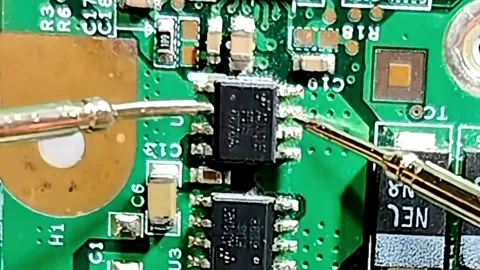Microchip Testing and Fault Finding on Circuit Board Stock Footage 333503809