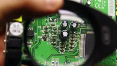 Microchippanel, the board is viewed under a magnifying glass Video stock 230490195
