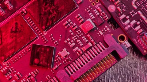 Microchips in alarming flashing red and blue lights on rotating surface. Stock Footage 246953227
