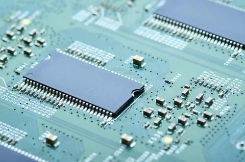Microchips and electronic components on the board close-up Stock Photos