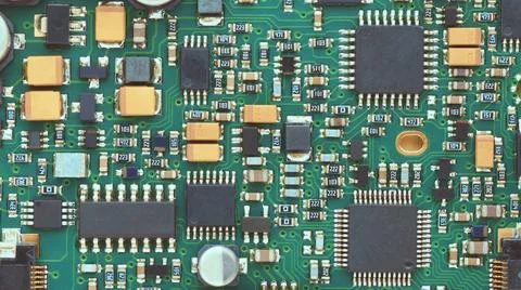 Microchips and electronic components on a green board Stock Photos