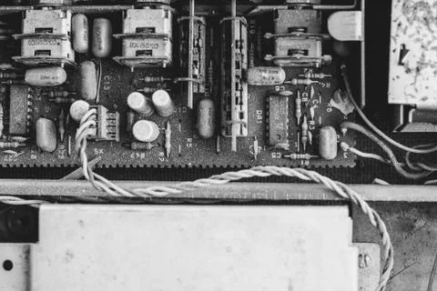 Microchips in old circuit board printed circuit board. Stock Photos