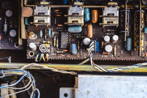 Microchips in old circuit board printed circuit board. Stock Photos