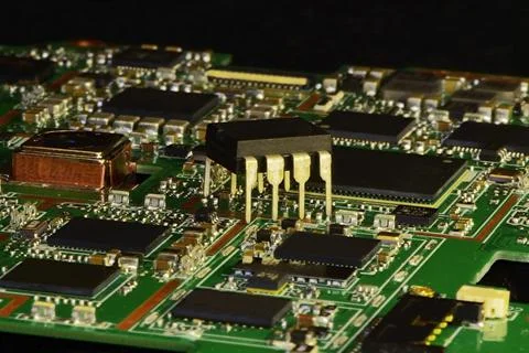 The microcircuit in the DIP8 case is installed over the mounting of open-fram Stock Photos