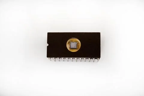 The microcircuit. An old microcircuit on a white background. An electronic .. Stock Photos