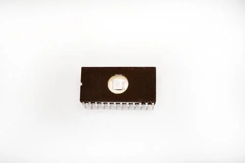 The microcircuit. An old microcircuit on a white background. An electronic .. Stock Photos
