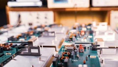 Microcircuits and components lie on metal plates Stock Photos
