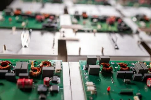 Microcircuits and components lie on metal plates Stock Photos