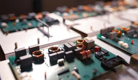 Microcircuits and components lie on metal plates Stock Photos