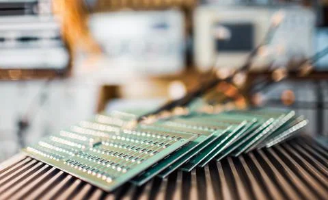 Microcircuits and components lie on metal plates Stock Photos