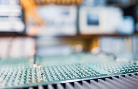 Microcircuits and components lie on metal plates Foto stock