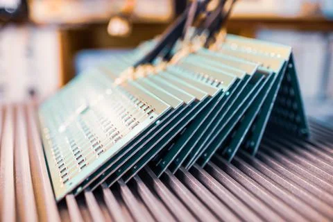 Microcircuits and components lie on metal plates Stock Photos