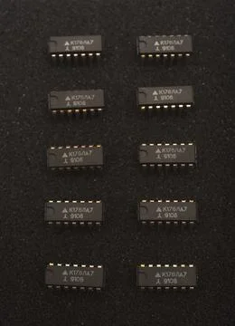 Microcircuits on black foam. Multiple chips on a substrate. Stock Photos