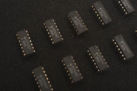Microcircuits on black foam. Multiple chips on a substrate. Stock Photos
