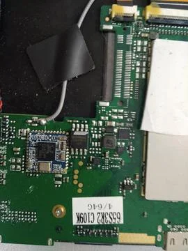 Microcircuits of an electrical product board on a desktop. Stock Photos
