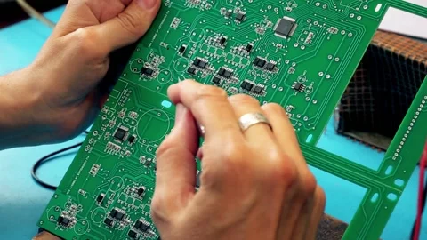 Microcircuits  technology. Male hands close-up solder the board. Chip, Stock Footage 165931189