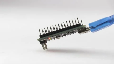 Microcontroller board with the programmable cable connected displaying lights Stock Footage 201615578