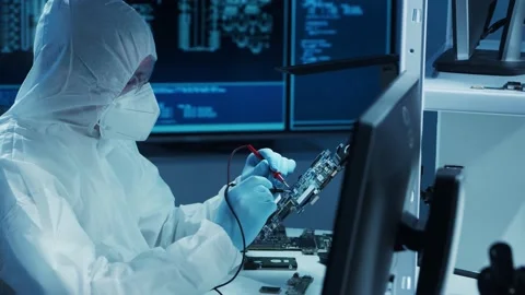 Microelectronics engineer works in a modern scientific laboratory on computing Stock Footage 149783912