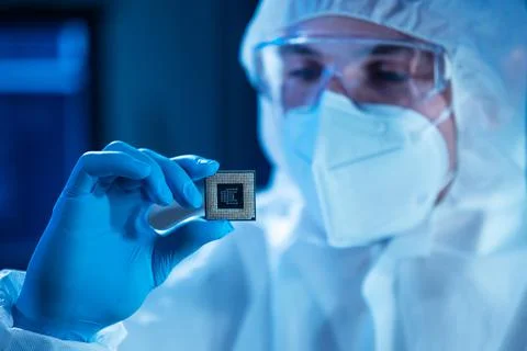 Microelectronics engineer works in a modern scientific laboratory on computing Stock Photos