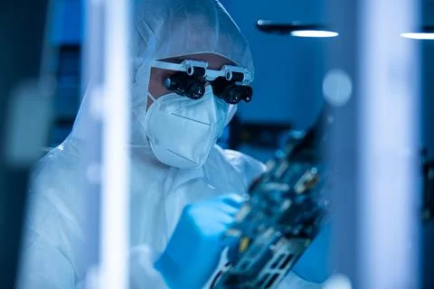Microelectronics engineer works in a modern scientific laboratory on computing 写真素材