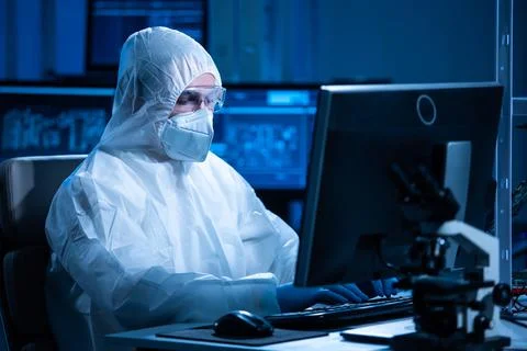 Microelectronics engineer works in a modern scientific laboratory on computing Stock Photos